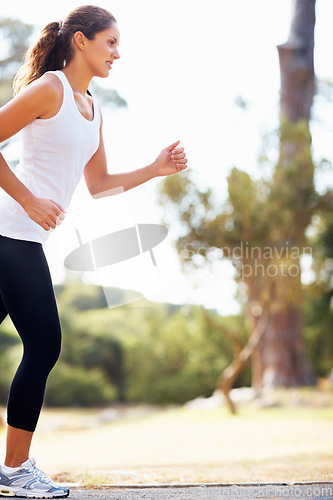 Image of Running, health and park with woman in nature for fitness, speed and cardio challenge. Wellness, sports and workout with female runner training in outdoor path for exercise, fast and performance