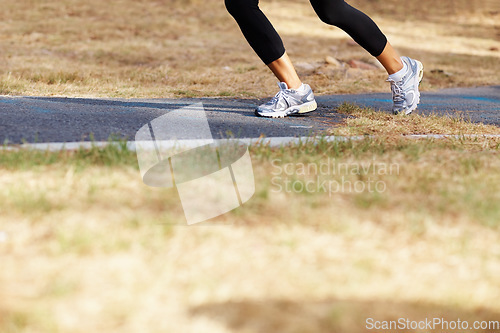 Image of Running, park and shoes of woman in nature for fitness, speed and cardio challenge. Wellness, sports and workout with female runner training in outdoor path for exercise, fast and performance