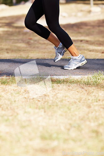 Image of Running, workout and shoes of woman in nature for fitness, speed and cardio challenge. Wellness, sports and health with female runner training in outdoor path for exercise, fast and performance