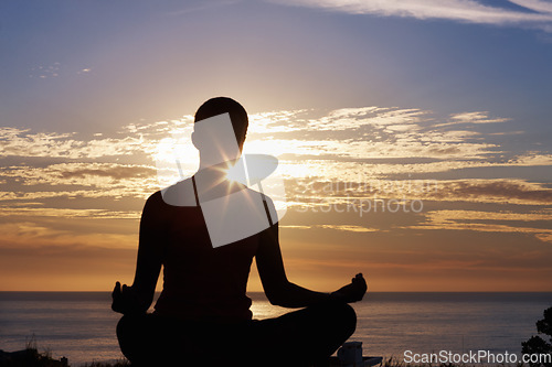 Image of Person, meditation and yoga in beach sunset for zen fitness, calm exercise and mindfulness or holistic wellness in silhouette. Back and nature with lotus hands, outdoor peace and mental health by sea