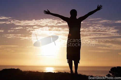 Image of Beach, sunset and woman with open arms freedom in nature for vacation celebration on sky background. Night, travel and person at the ocean with energy, success or silhouette with fresh air on holiday