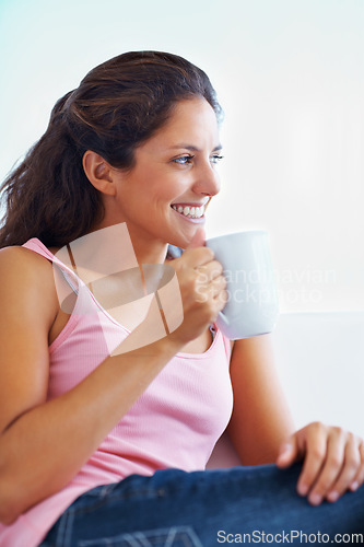 Image of Thinking, coffee break and woman relax house happy, resting or enjoying peaceful moment, day off or me time. Face, smile and female person in a living room with tea, calm or weekend freedom chilling