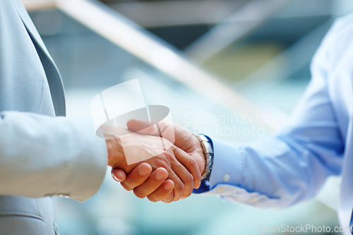 Image of Corporate people, shaking hands and welcome to meeting, partnership and introduction for deal at law firm in lobby. Closeup of business lawyer or clients handshake for success, support and consulting