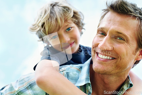 Image of Father, son and portrait or happy with piggyback for bonding, relationship and freedom with blue sky in nature. Family, man and boy child with playing, care and love for excitement, peace and support