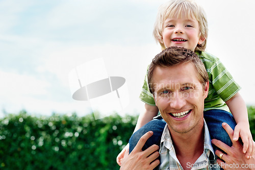 Image of Father, son and portrait or smile with piggyback for bonding, relationship and freedom with blue sky in garden. Family, man and boy child with playing, care and love for excitement, peace and support