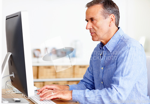 Image of Mature man at desk with computer, typing and administration for business networking. Report, review and senior businessman writing website article for online feedback, research and office management.