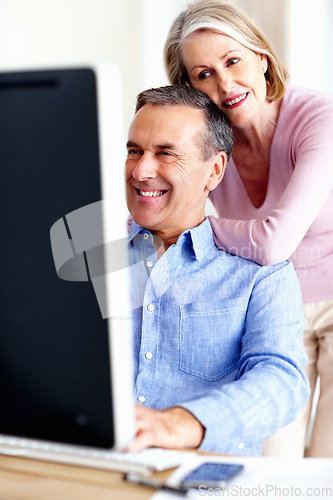 Image of Financial, planning or senior couple with computer in home for retirement savings or pension budget. Hug, finance news or mature man with a happy woman for house bills, profit growth or research