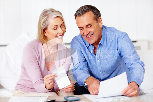 Image of Home, finance and senior couple with documents, savings and mortgage debt with insurance checklist, budget and asset management. Apartment, old woman and mature man with paperwork and retirement fund