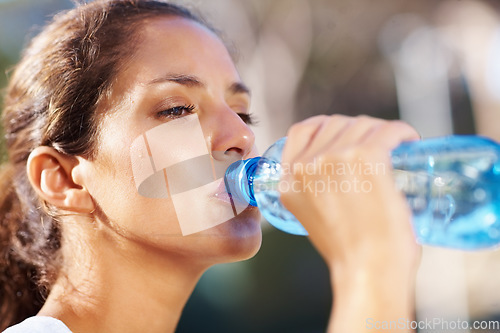 Image of Fitness, woman and drinking water outdoor for running, wellness or training in a park. Sports, liquid and face profile of female runner outside for exercise, workout or morning cardio run in a forest