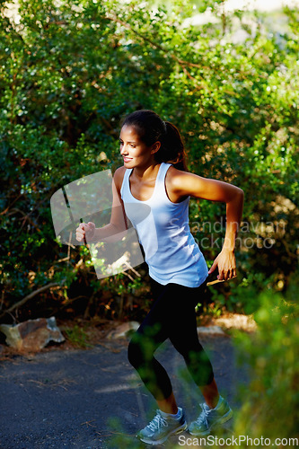 Image of Running, health and fitness with woman in nature for summer, speed and cardio challenge. Wellness, sports and workout with female runner training in outdoor path for exercise, fast and performance