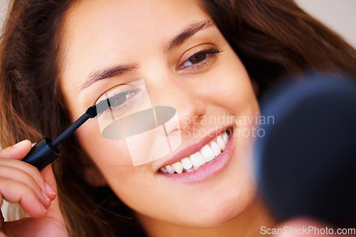 Image of Mirror, makeup and happy woman with mascara brush application in a house for morning routine or eyelash care. Face, beauty and lady person smile for lashes, volume or cosmetic, extensions or results