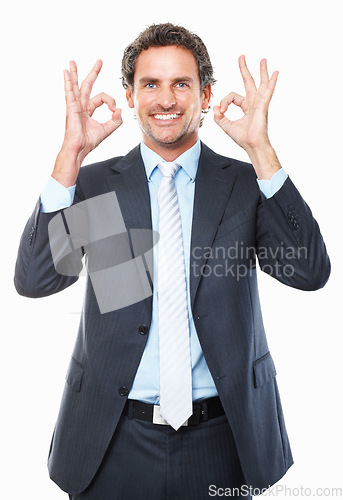 Image of Businessman, ok and smile in portrait, promotion and agreement or approval by white background. Male person, face and emoji or icon, yes and like or success, satisfaction and good job or well done