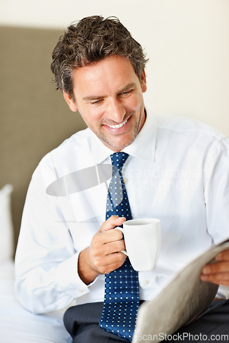 Image of Businessman, face and happy with coffee or newspaper in bedroom of home for morning routine and news. Entrepreneur, person and reading with article, cappuccino or espresso for story and information