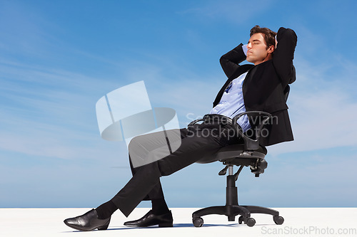 Image of Business man, relax and outdoor nap of a corporate professional in a chair with peace from success. Worker, calm and young male employee and suit with mockup space and blue sky with job and career
