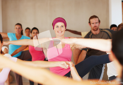 Image of Yoga class, stretching and people in warrior pose at gym, exercise and healthy body, wellness or pilates. Fitness, happy group and virabhadrasana balance, flexibility and practice in club together