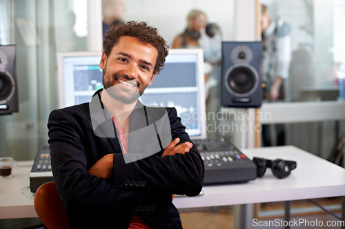 Image of DJ, arms crossed and recording studio portrait with a man and music producer with tech and computer. Sound engineer, audio technician and media with a professional in industry with synthesizer