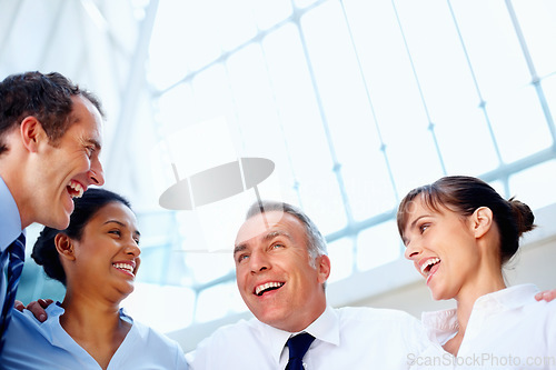 Image of Businesspeople, together and excitement with low angle in office for diversity, unity and support. Corporate, man and woman with happiness for global, success or goal with future, partnership or team