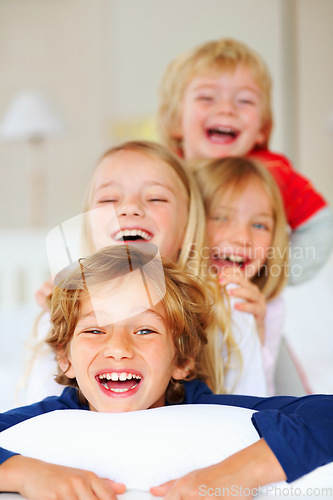 Image of Happy, laugh and portrait of sibling children in home for bonding, love and cute relationship on sofa. Family, childhood and face of young kids for playing, fun and relaxing in living room together