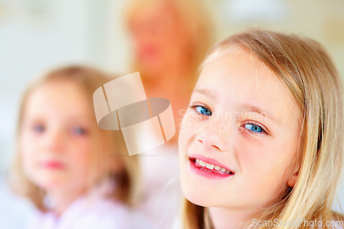 Image of Happy, smile and portrait of sibling girls in home for bonding, love and cute relationship. Family, childhood sisters and face of young kids for playing, fun and relaxing in living room together