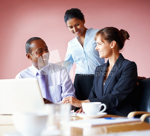 Image of Collaboration, corporate people and meeting with a laptop in the boardroom for planning or strategy. Smile, teamwork or diversity with business men and women working on a computer for company vision