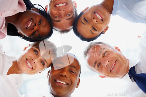 Image of Portrait, huddle or business people with smile, group and professionals with partnership, team building and solidarity. Happy, face or staff circle with success, collaboration and company development