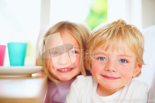 Image of Kids, breakfast and portrait at home in the morning with food, smile and happy from eating. Family, dinner table and hungry young child with meal for health and nutrition in a house with sibling