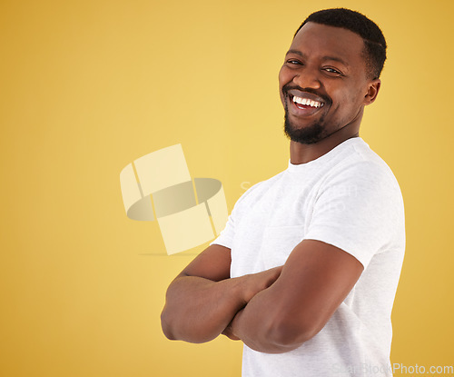 Image of Man, portrait and smile in studio on yellow background, confidence or mockup space. Black person, model and happy face in positive mood for relax decision or deal information, yes news or show offer