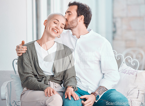 Image of Couple, hug and kiss on sofa with smile, care and bonding with love, memory and sitting in home living room. Man, woman and happy together with embrace on lounge couch, relax and pride in apartment