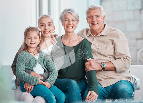 Image of Grandparents, girl and mother in portrait on couch with hug, care or bonding with love in family home lounge. Elderly people, kid and mom with smile, relax and together on living room sofa in house