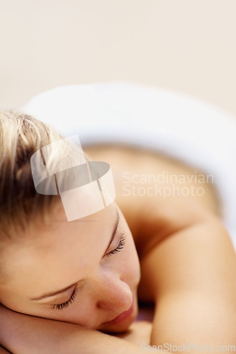 Image of Woman, sleeping and rest on bed in spa for health, wellness and recovery with closeup, peace or quiet. Girl, space and tired at resort for rehabilitation, massage or physical therapy for body fatigue