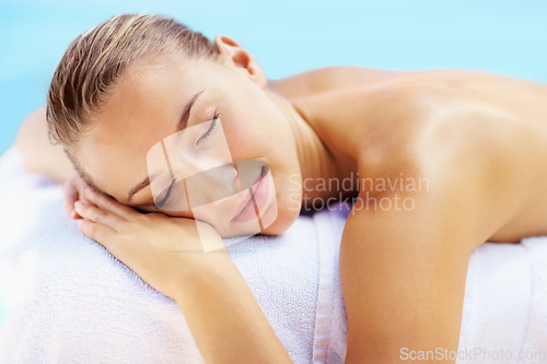 Image of Woman, sleeping and health on bed in spa to relax, wellness and recovery with rest, peace and quiet. Girl, calm and natural at resort for rehabilitation, blue sky or physical therapy for body fatigue