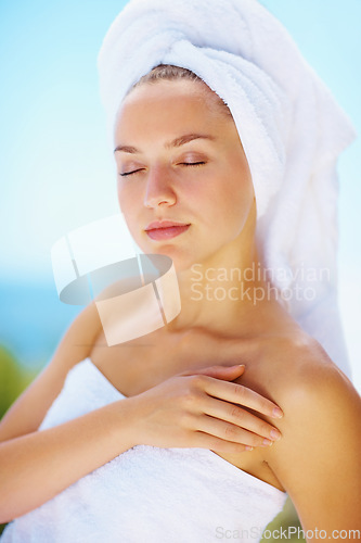 Image of Sleep, woman and spa towel outdoor with wellness, skincare and health treatment with blue sky. Tropical vacation, rest and zen of a calm female person on vacation with body care and ready for massage