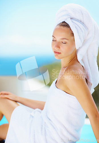 Image of Relax, woman and spa resort outdoor with wellness, skincare and health treatment with blue sky. Hotel pool, rest and zen of a calm female person on vacation with body care and ready for massage