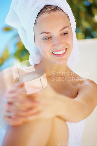 Image of Happy, spa and young woman with towel for hygiene, wellness and self care treatment. Beauty, smile and female person from Canada with health, cosmetic and clean body skin routine at natural salon.