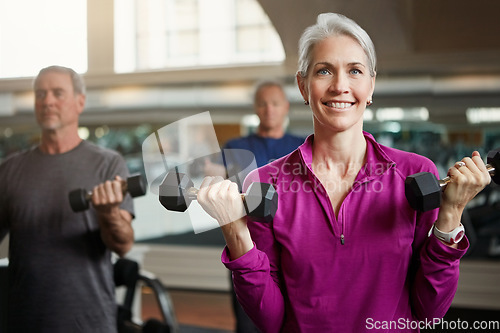 Image of Senior fitness, club and people with dumbbells at gym for training, health and wellness, sport or exercise. Class, workout and elderly group of friends at a studio for bodybuilding or weightlifting