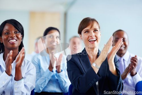 Image of Corporate, people and applause for presentation at conference, workshop or seminar in New York. Diverse group, female manager and excitement in audience with smile, happy and clapping for speaker