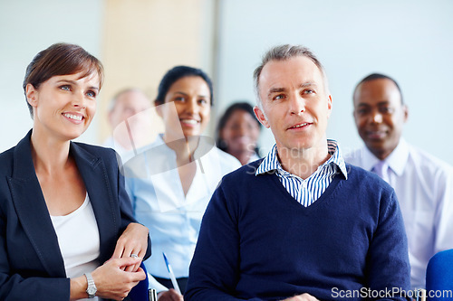 Image of Businesspeople, audience and listen to presentation at conference, workshop or seminar in New York. Diverse group, man and woman with excited expression for discussion, speaker or panel in boardroom