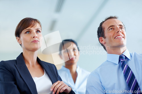 Image of Businesspeople, together and listen to presentation at seminar, workshop or conference in boardroom. Woman, man and executive career with vision for future growth, planning or investment by low angle