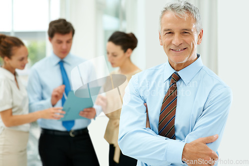 Image of Smile, portrait and senior businessman with team of people in the office with positive, good and confident attitude. Happy, career and manager with a group of professional employees in workplace