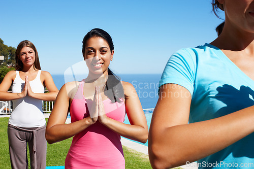 Image of Namaste, yoga and portrait of women on grass together for fitness, exercise or mindfulness resort. Nature, pilates and happy friends at outdoor holistic health retreat for wellness, balance and zen.