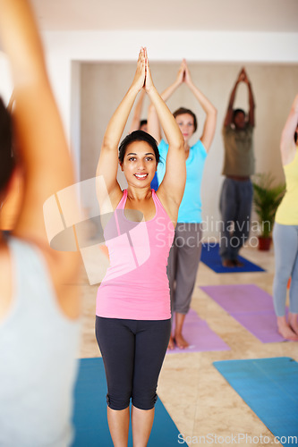 Image of Fitness, yoga and people in class stretching, exercise and workout on mat for wellness. Pilates, health club and portrait of instructor with men and women for flexibility, balance and healthy body