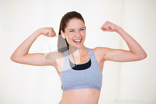 Image of Woman, portrait or happy in studio with flex for fitness, wellness or workout strength with sportswear. Person, athlete or smile for biceps, exercise and training on white background or mock up space