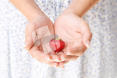 Image of Hands, woman and holding strawberry fruits for detox, vegan diet and eco nutrition of fresh ingredients. Closeup of red berries, healthy food and sustainable benefits of vitamin c, wellness and care