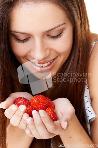 Image of Woman, smile and holding strawberry fruits for detox, vegan diet and fresh organic ingredients for nutrition. Face of happy girl with red berries, healthy food and sustainable benefits of vitamin c