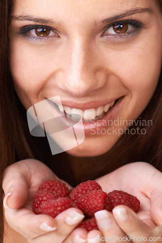 Image of Face, woman and healthy raspberry fruits in hands for detox, vegan diet and eco nutrition. Portrait, happy girl and holding red berries for organic food, sustainable wellness or benefits of vitamin c