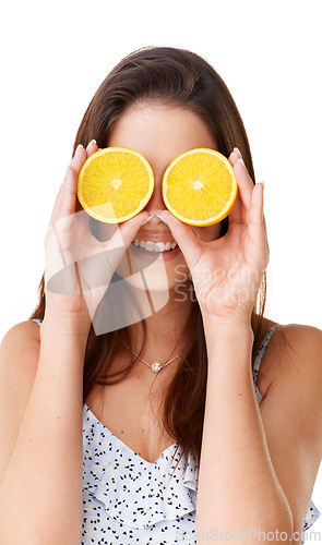 Image of Happy woman cover face with orange fruits in studio for detox, vegan diet and natural skincare on white background. Girl, citrus food and healthy nutrition for sustainable benefits, vitamin c or glow