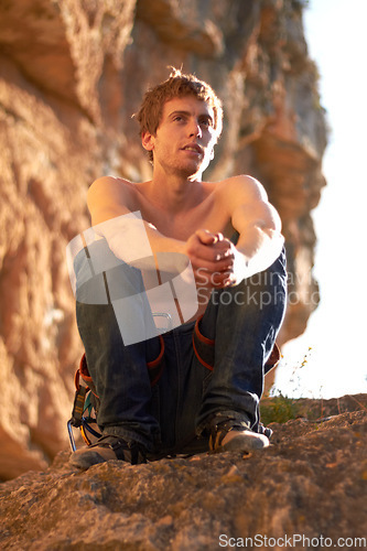 Image of Thinking, rock climbing and man with fitness, relax and exercise with summer environment and countryside. Person, workout and bare with guy, nature and wellness with health, fresh air and breathing