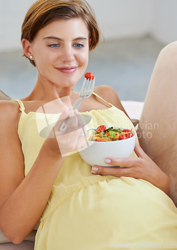 Image of Pregnant woman, salad and smile on sofa for health, nutrition and wellness in living room of apartment. Person, vegetables or happy on couch of lounge for relax, pregnancy and healthy diet with fiber