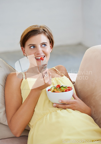 Image of Pregnant woman, salad and happy on sofa for health, nutrition and wellness in living room of apartment. Person, vegetables or smile on couch of lounge for relax, pregnancy and healthy diet with fiber