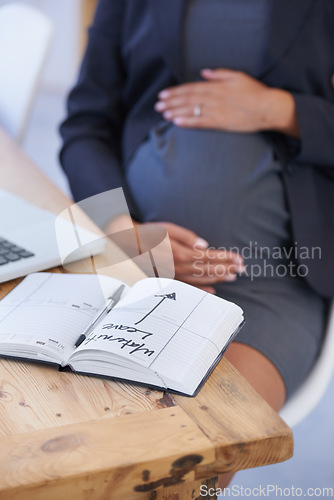 Image of Woman, pregnant and maternity date in book for work break, childcare or waiting for motherhood. Female person, stomach and hands as professional employee for career relax, note for infant schedule